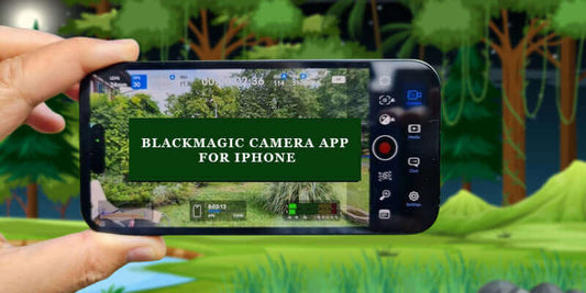 Person holding an iPhone running Blackmagic Camera App in a lush outdoor setting.